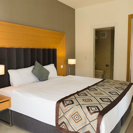 Ramada Resort Kusadasi & Golf Luaran gambar A bedroom at the hotel